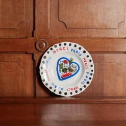 Assiette plate en faïence Merci